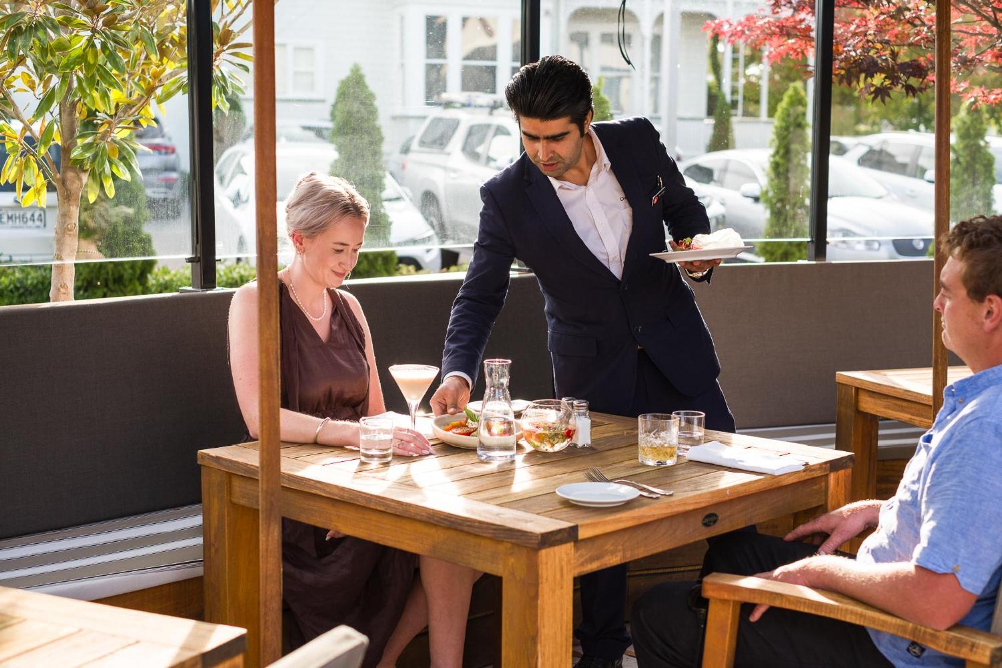 Carnmore Chateau Marlborough Blenheim Exterior photo A waiter serving a customer